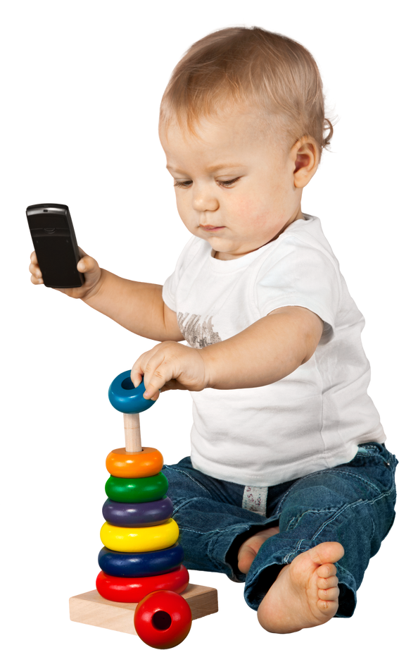 Baby boy holding a mobile phone and playing with a toy